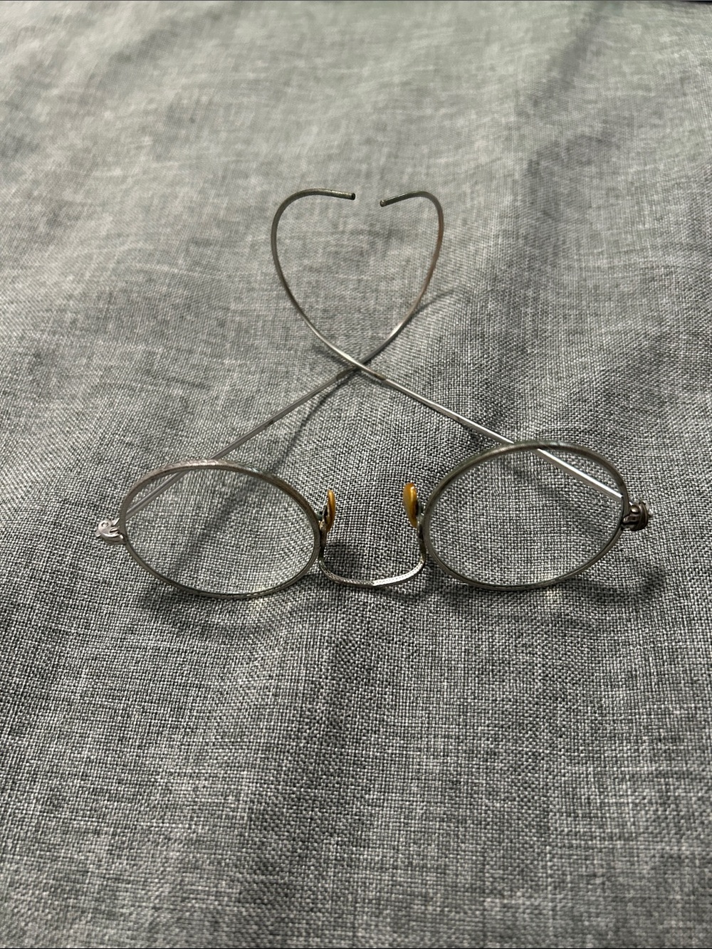Antique wire spectacles round frames with wrap around the ears for a secure fit.